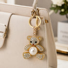 Da Meso Teddybär-Schlüsselanhänger mit Strass und Perle in Gold und Silber – elegantes Accessoire für Handtasche und Schlüsse – Bild 2